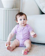 Short Sleeve Zipper Bodysuit In Lilac, 9-12m