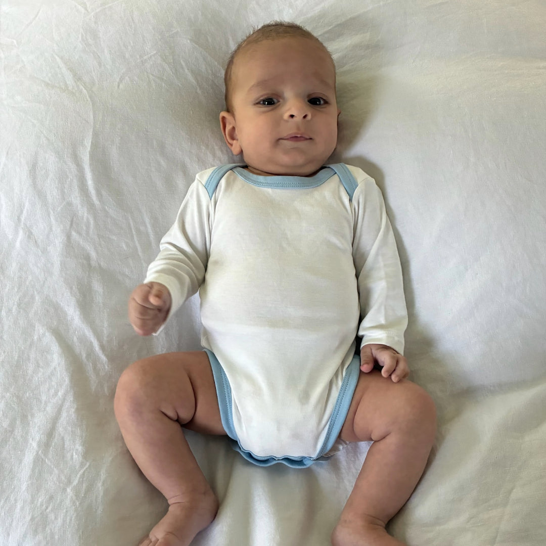 Long Sleeve Bodysuit In White With Chambray Blue