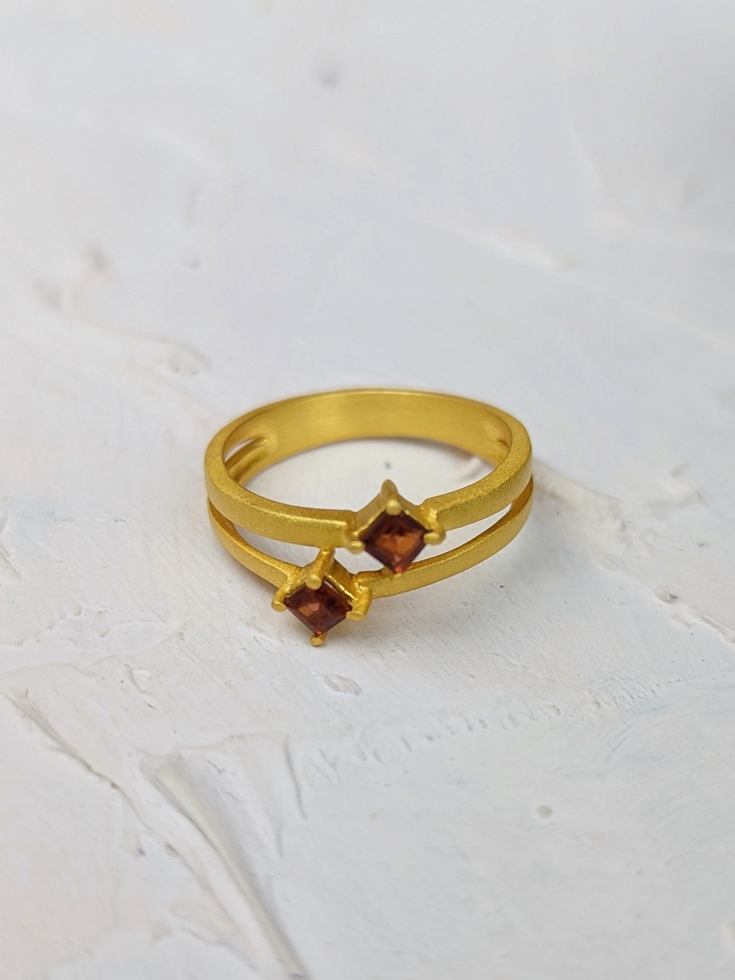 Garnet And Gold Split Shank Ring