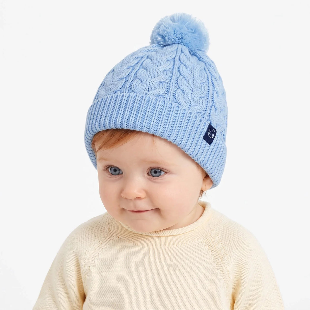 Cable Knit Pom Beanie In Baby Blue