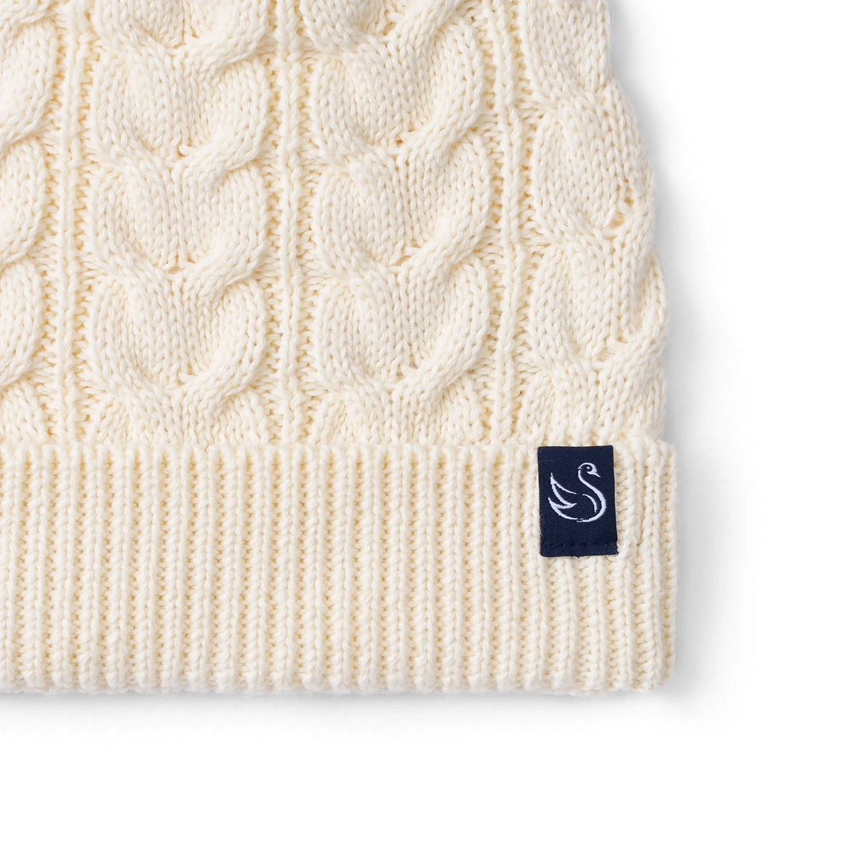 Cable Knit Pom Beanie In Cream