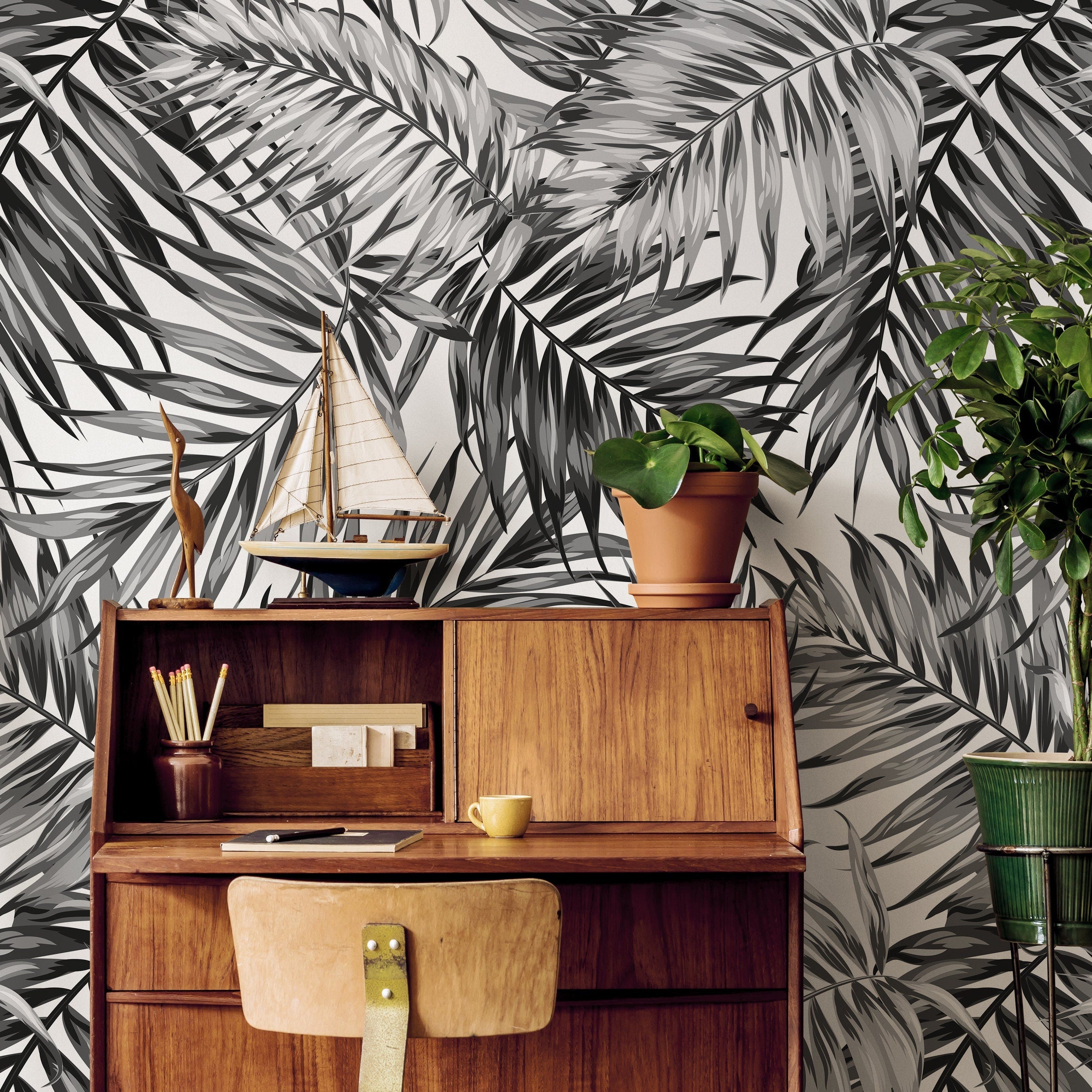 Botanical Wallpaper With Overlapping Palm Leaves In Black And Grey - B031