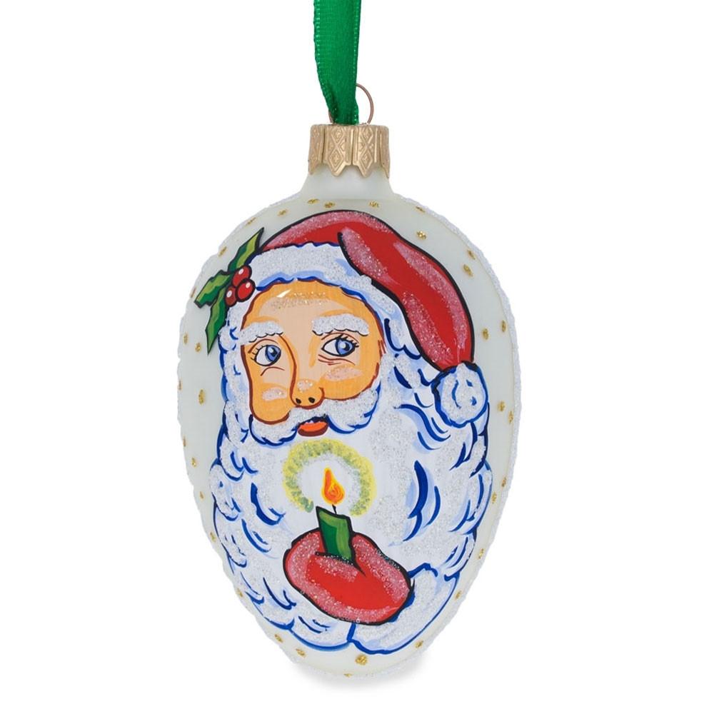 Santa Holding Candle Glass Egg Ornament 4 Inches