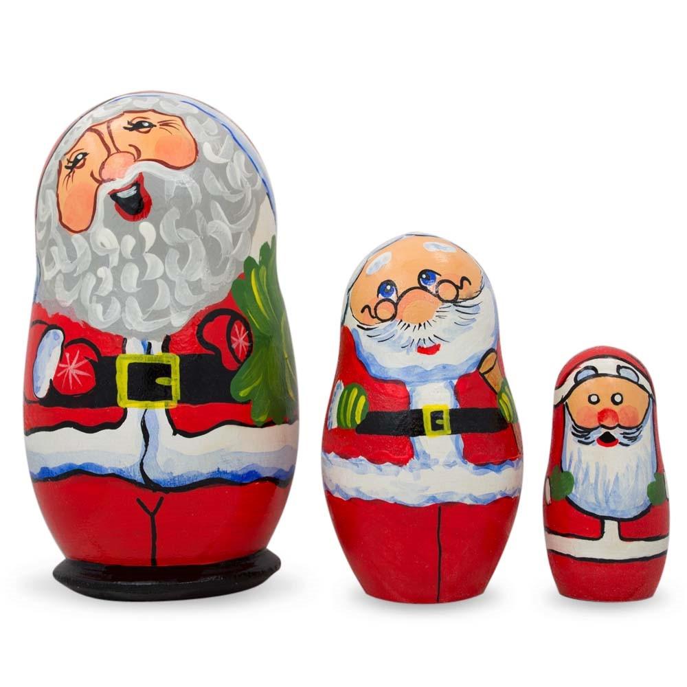 Set Of 3 Smiling Santa Claus Figurines Wooden Nesting Dolls 4.25 Inches