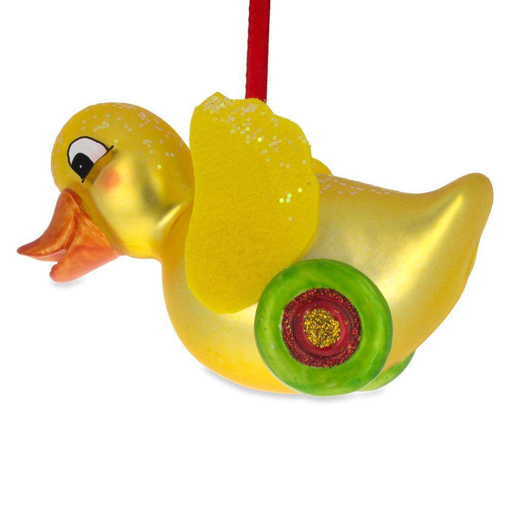 Yellow Duck Rolling On Wheels - Blown Glass Christmas Ornament