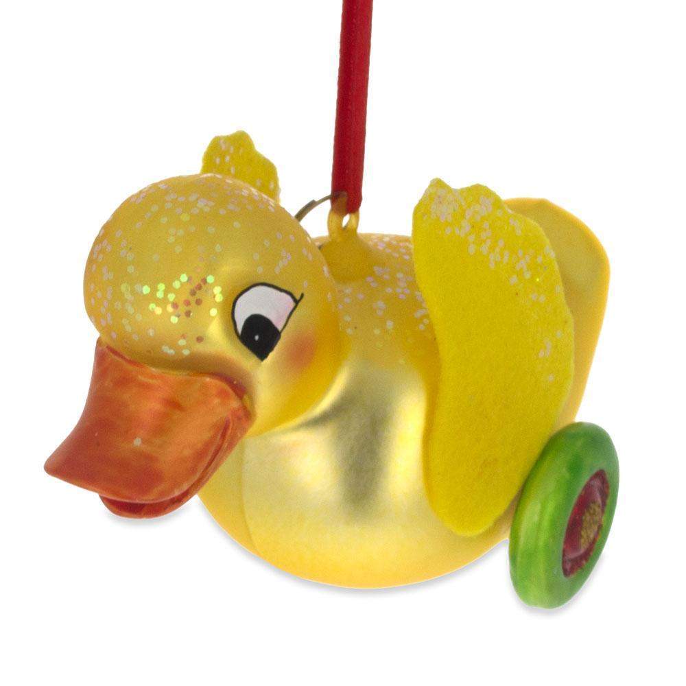 Yellow Duck Rolling On Wheels - Blown Glass Christmas Ornament