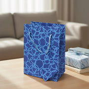 Set Of Six Recycled Cotton Gift Bags With Tag In Blue Circles Design