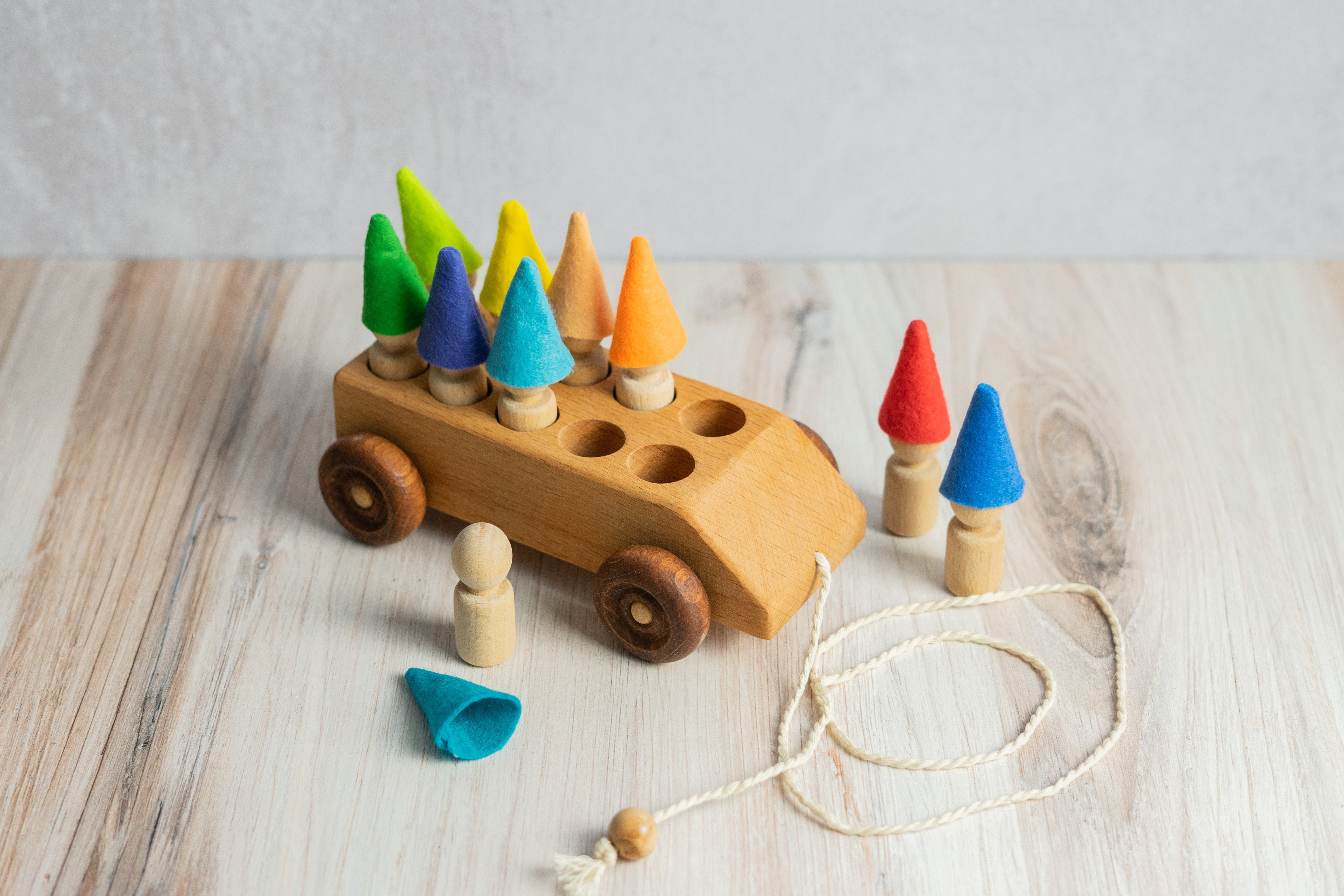 Wooden Toy Car With Ten Pegs In Multi-colored Hats