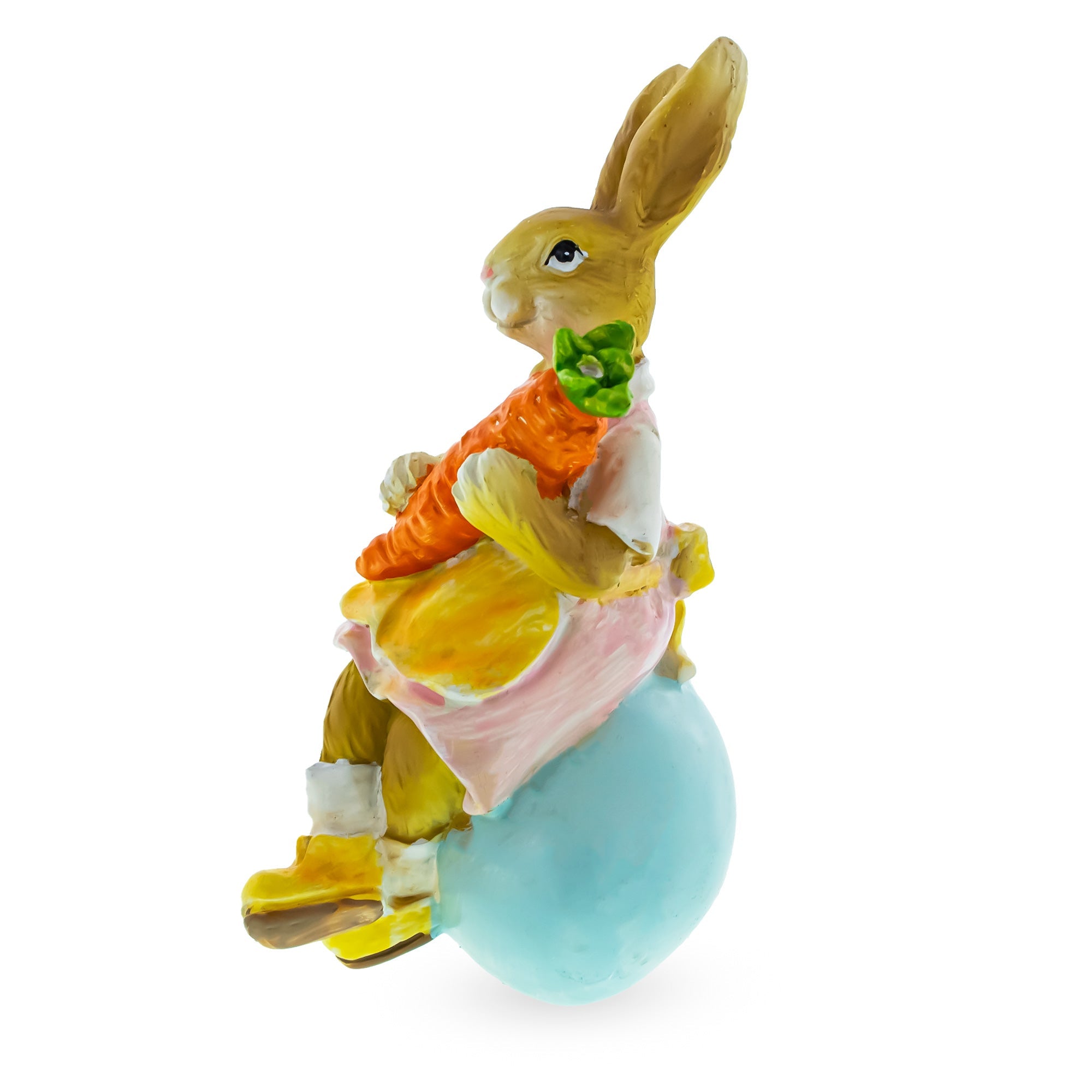 Springtime Serenity: Mother Bunny Cradling Carrot Atop A Decorative Easter Egg Figurine