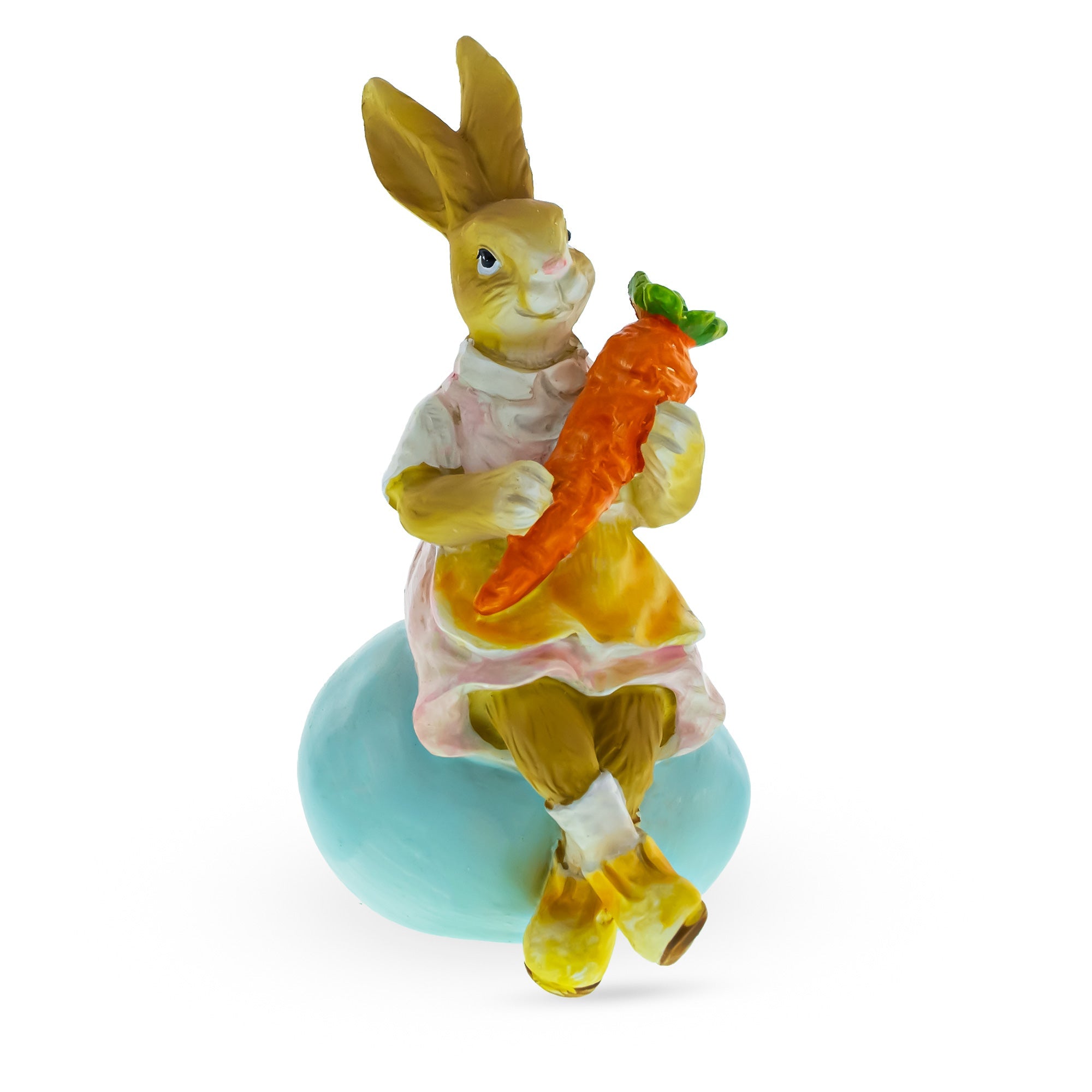 Springtime Serenity: Mother Bunny Cradling Carrot Atop A Decorative Easter Egg Figurine